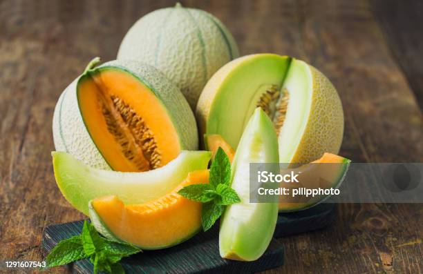 Fresh Ripe Melons On The Wooden Table Stock Photo - Download Image Now - Melon, Honeydew Melon, Cantaloupe