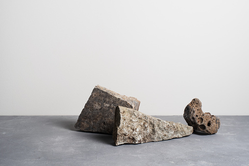 Abstract composition of natural materials stones. Modern minimal still life. Ultimate grey color