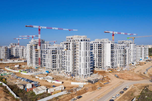 istock Residential Construction site with Cranes and building in progress. 1291607759