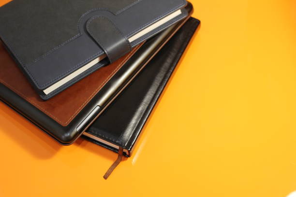 istock books on the orange table 1291607784
