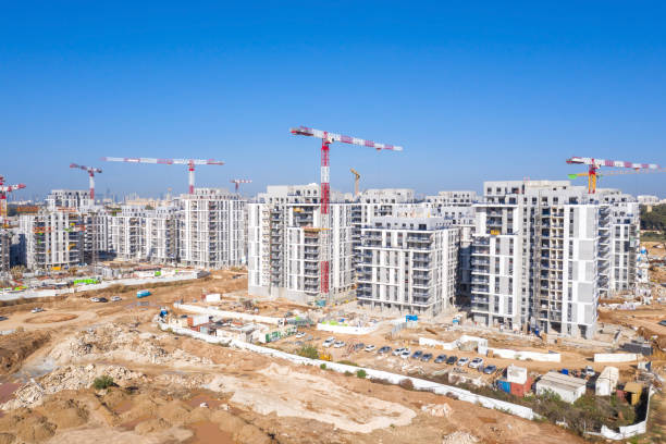 Residential Construction site with Cranes and building in progress.