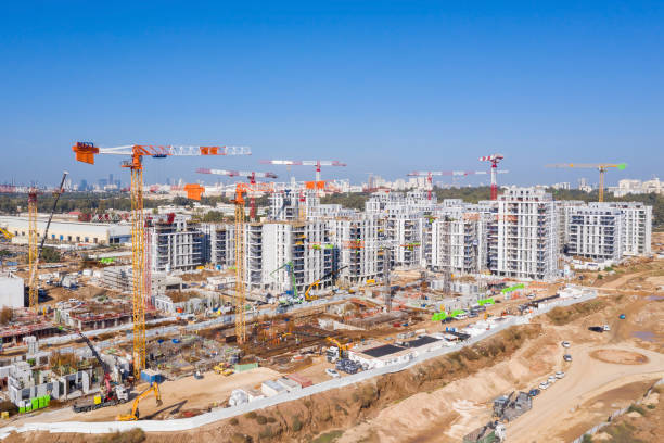 istock Residential Construction site with Cranes and building in progress. 1291608501