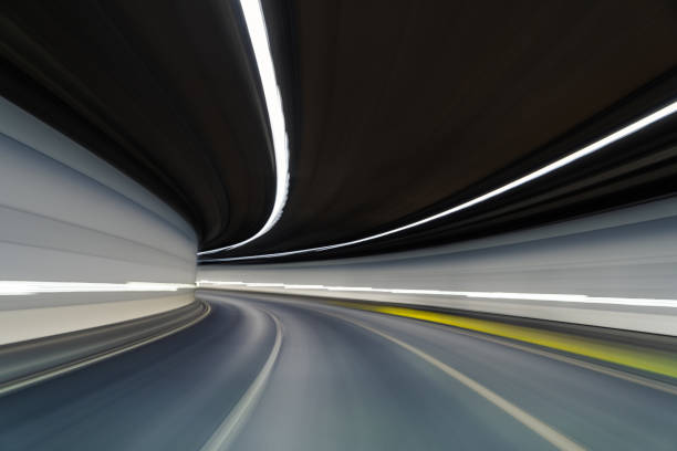 istock POV Car Driving at Empty Tunnel 1291609118