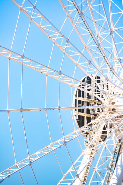 ferris wheel against the blue sky close up - costume stage costume sunlight carnival imagens e fotografias de stock