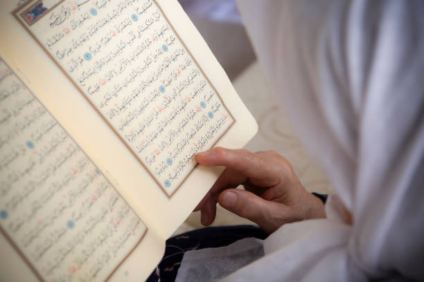 istock Muslim Turkish Woman's face who is reading Holy Quran 1291610501