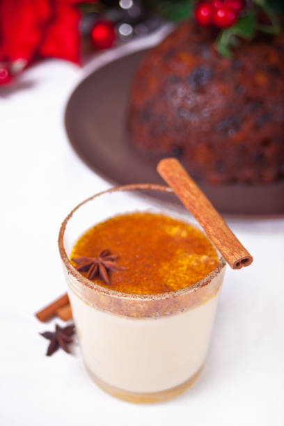 istock Glass of holiday egg nog on the celebration table 1291611537
