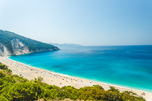 Troulos beach, Skiathos island, Greece. Beautiful vivid panorama view of blue aegean sea coast from wild cliff.  Summer holiday vacation tour to greek islands.
