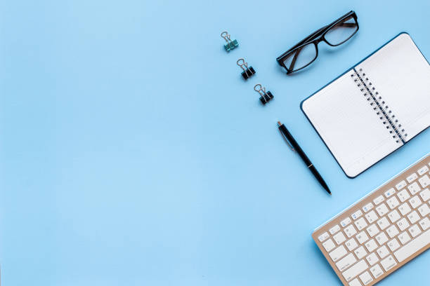 istock Workplace flat lay with computer and office supplies top view 1291611666