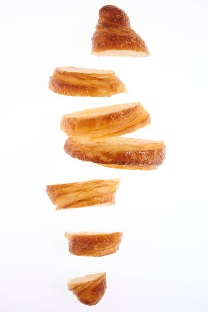 Growing French croissant on a white background lurie stock pictures, royalty-free photos & images