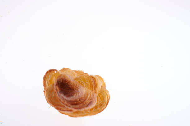 Growing French croissant on a white background lurie stock pictures, royalty-free photos & images