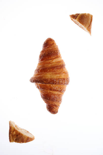 Growing French croissant on a white background lurie stock pictures, royalty-free photos & images