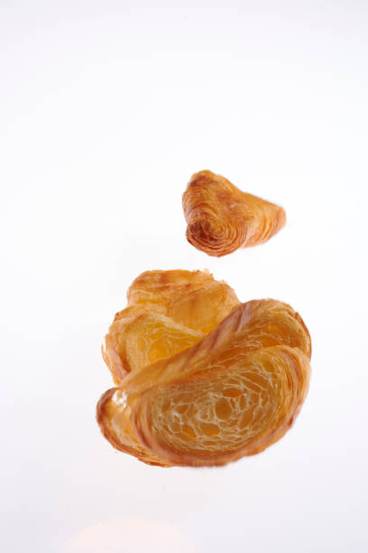 Growing French croissant on a white background lurie stock pictures, royalty-free photos & images
