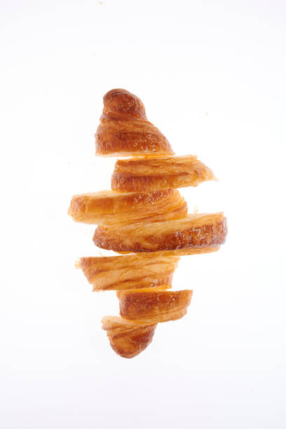 Growing French croissant on a white background lurie stock pictures, royalty-free photos & images