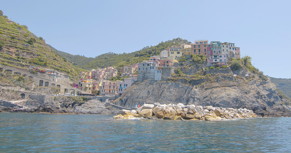Mediterranean village is perched on top of rocky cliff