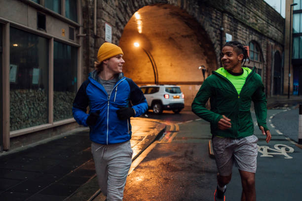 istock Friends Running at Night 1291614546