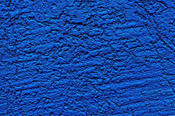 istock The wall is made of plaster. Rough surface. Solid color abstract background. 1291617815