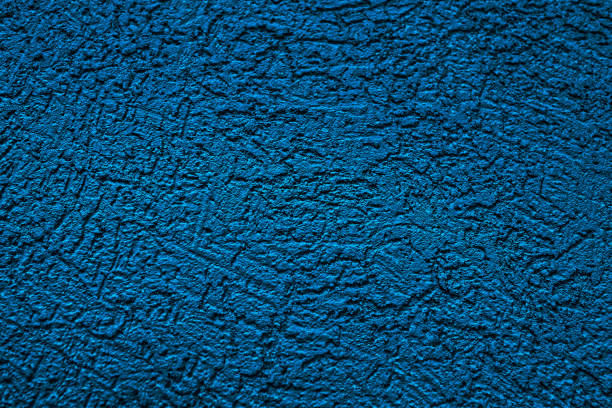 istock The wall is made of plaster. Rough surface. Solid color abstract background. 1291617955