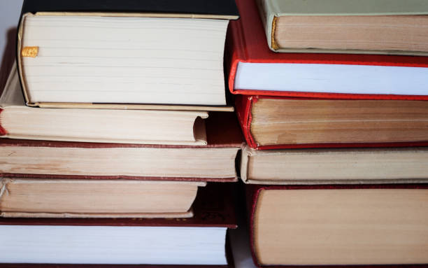 istock stack of old book, education concept background, many books piles with copy space for text 1291619192