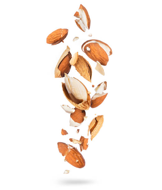 istock Crushed almonds into many pieces in the air isolated on white background 1291620029