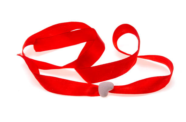 istock red ribbon with heart isolated 1291620280