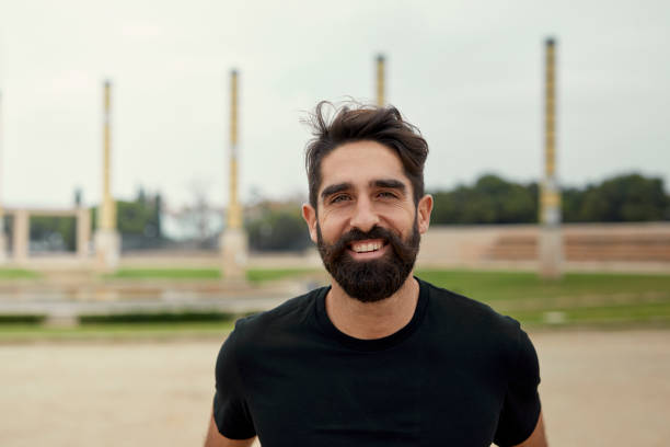 istock Spanish athlete smiling and looking at the camera in an outdoor facility 1291621082