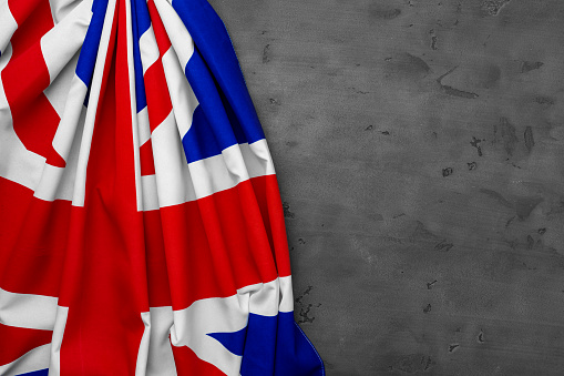 Flag of United Kingdom on grey background, copy space