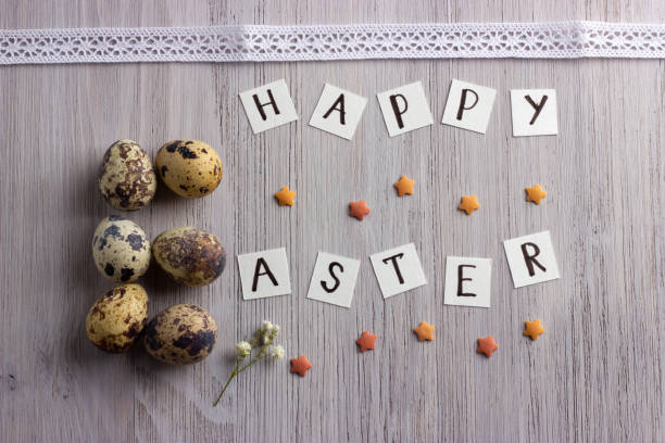 istock Happy Easter letters and easter eggs on the wooden table 1291622763