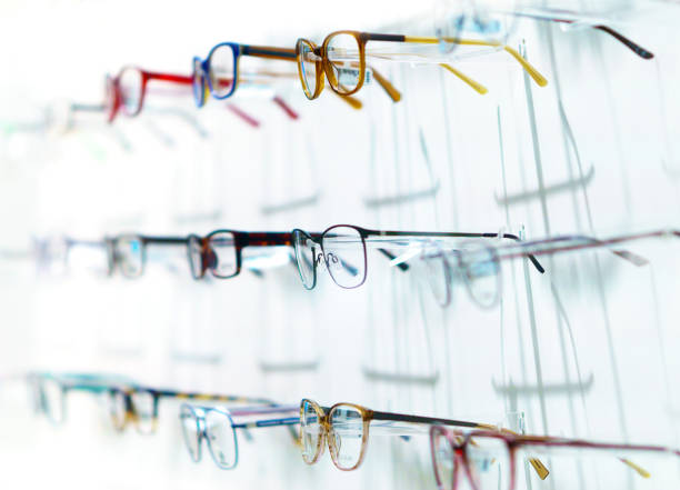 istock Optic shop - Board with glasses on white 1291627229