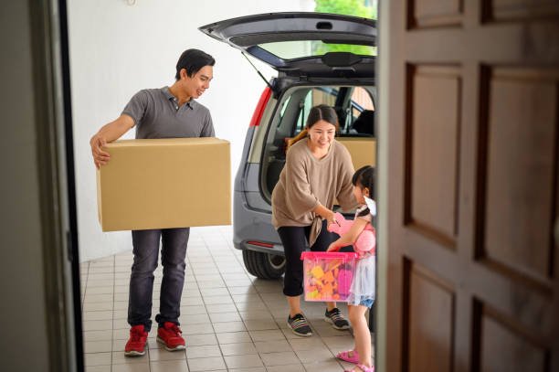 istock Family moving in new house 1291630373