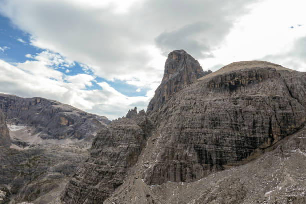 istock Oberbachernspitze - A close up view on a massive, high and desolated mountain wall in Italian Dolomites 1291630912