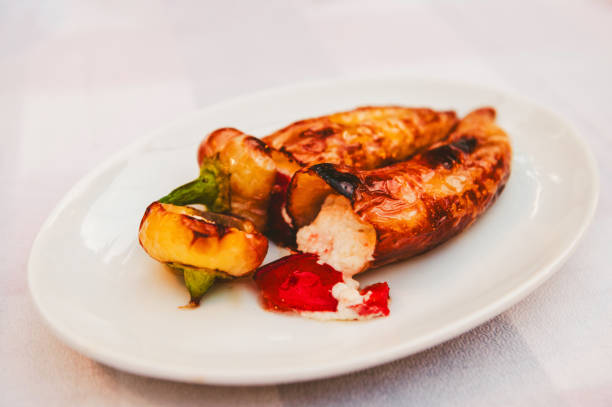 Roasted peppers stuffed with feta cheese on the plate
