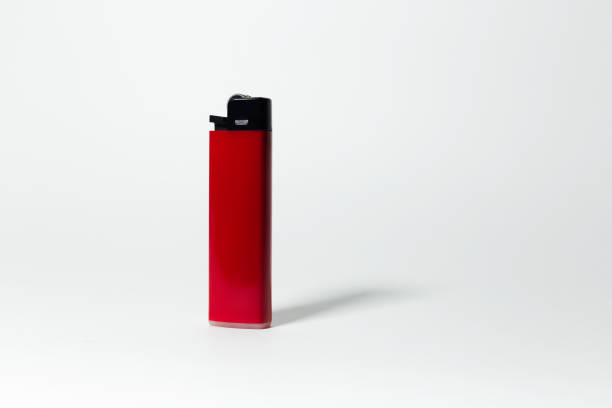 istock Close-up of red lighter on white background. Studio photo with copy space. 1291633033
