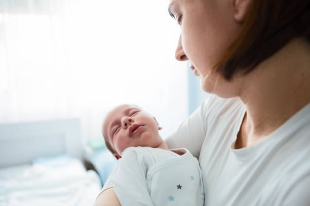istock Beautiful mother with her baby 1291633136