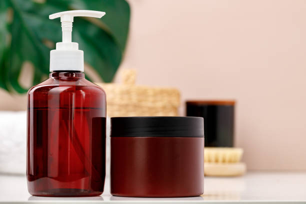 istock Brown skincare containers in bathroom close up 1291633838