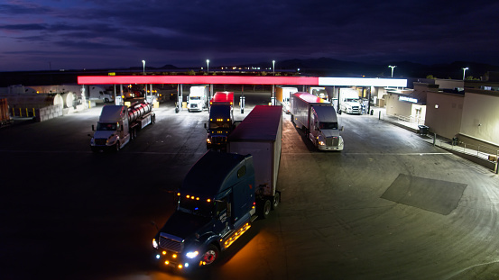 Aerial shot of a truck stop in Arizona at night.