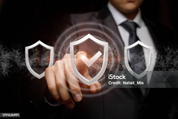 Businessman Exposes The Selected System Protection Stock Photo - Download Image Now