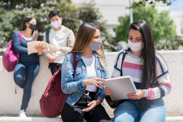 istock Students wearing facemasks at school during the COVID-19 pandemic 1291637978