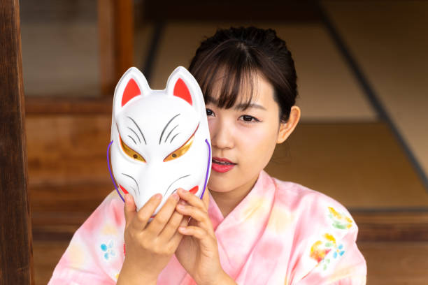istock Woman in fox face and yukata 1291637990