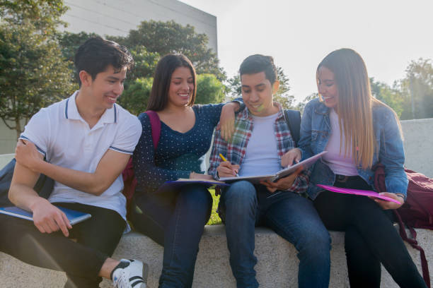 istock College students studying together at the school 1291638030