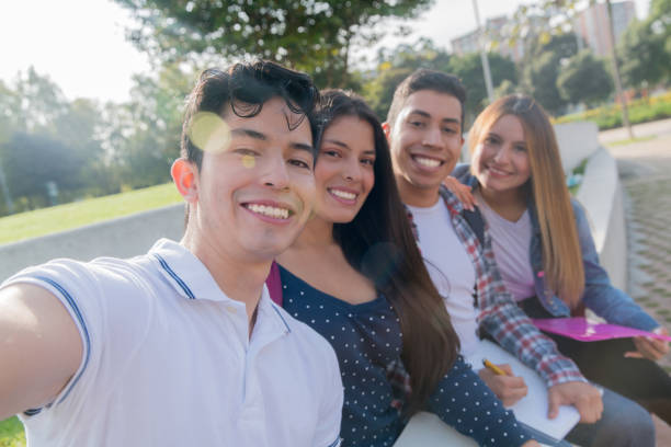 istock Happy group of students taking a selfie at the campus 1291638038