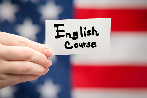 English course text on a card. American flag background.