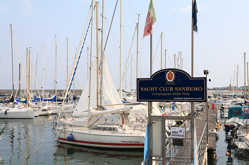 Sanremo, Italy - July 03, 2009: Marina, where there are many sailboats and other boats. A small door leads to the pier of the local yacht club.