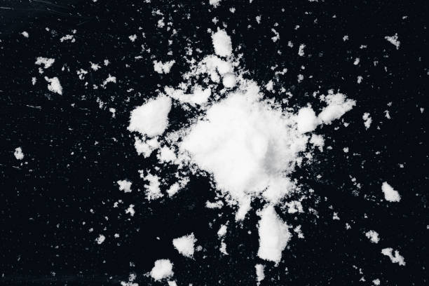 istock snowball splat on black wall 1291643604