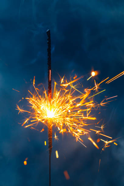 istock fire sparkler in dense smoke, abstract Christmas firework background 1291644381