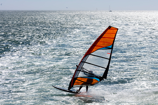 Many young people are enjoying windsurfing on a fine, windy Sunday afternoon at Miura Beach, Miura City, Kanagawa Prefecture. Miura Beach is located at the entrance to Tokyo Bay from the Pacific Ocean.