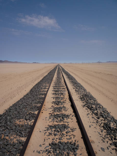 istock Railroad straight to the horizon 1291644829