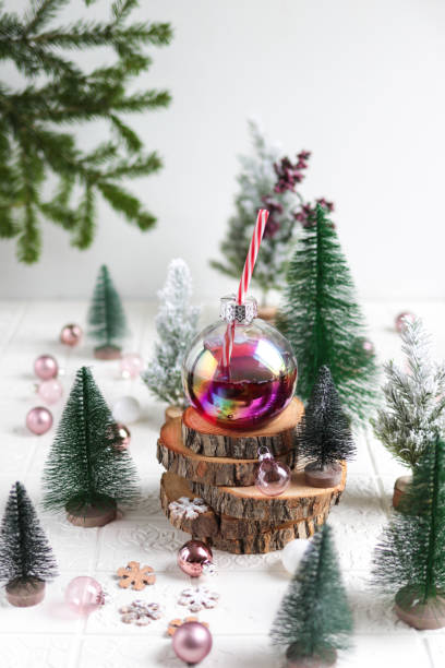 Red Christmas Cocktail drink served in Ornament glass bubble