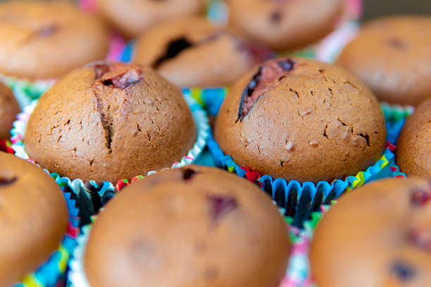 istock Chocolate muffin with fruits close-up 1291648843