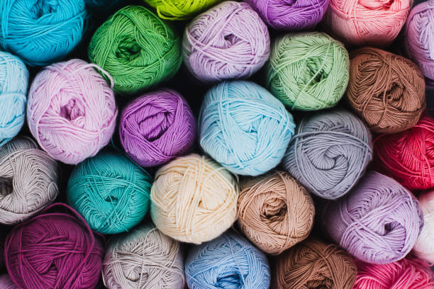 istock Knitting. Multicolored skeins of yarn on a gray background. Studio shooting. 1291648862