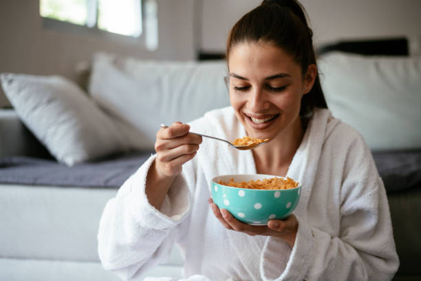 istock Young woman eating oatmeal 1291650350